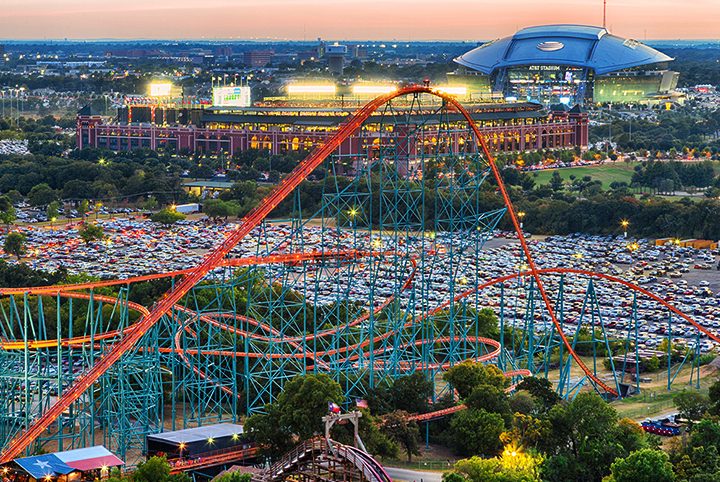 Arlington's stadium entertainment district at dusk, with AT&T Stadium lit up, where Texas Live! sits